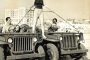 WWII-willys-jeeps-were-redeployed-onto-county-beaches-here-a-model-poses-with-two-county-lifeguards-in-1946